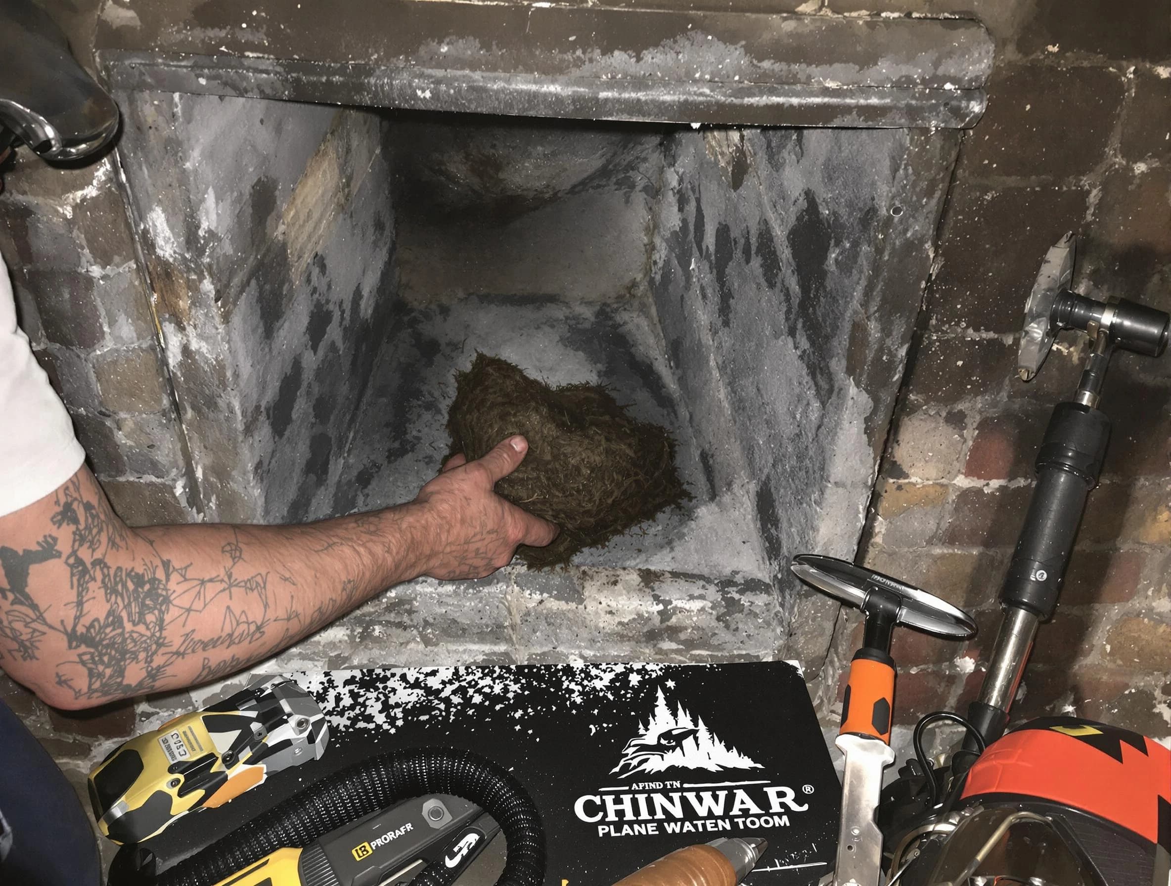 King George Chimney Sweep safely removing debris and screening chimney in King George, VA